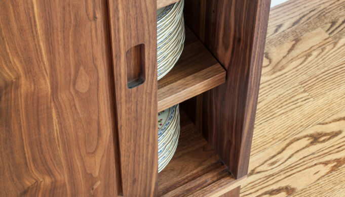 Shelving and sliding door detail Maria's Sideboard - walnut sideboard by Infusion Furniture - Milton MA